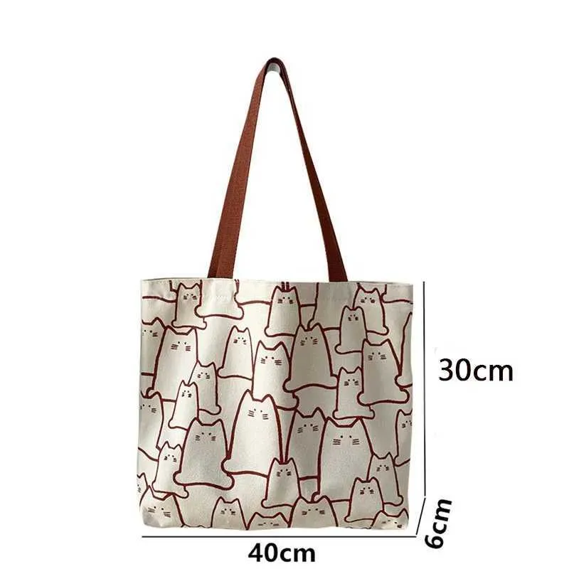 Canvas 2023 fashionable cute cat handbag messenger with zipper designer womens cartoon shoulder shopping bag Y241011_voghion.com