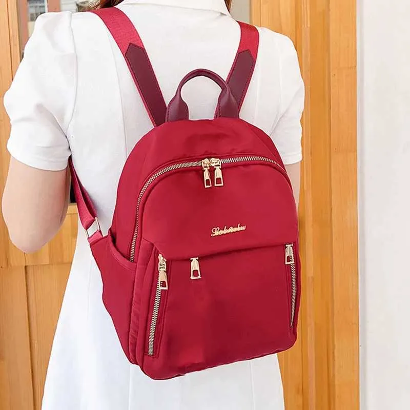 Sac à dos à la mode en nylon imperméable à haute capacité avec fermeture éclair solide 2024 hot selg Sac polyvalent pour femme Mujer Mochila_voghion.com