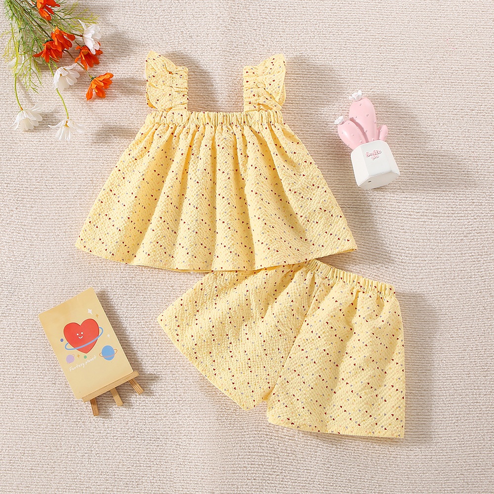 Peutermeisjes kinderkledingset van katoen, klein hartje, bedrukt, geel/roze strik, top en short_voghion.com