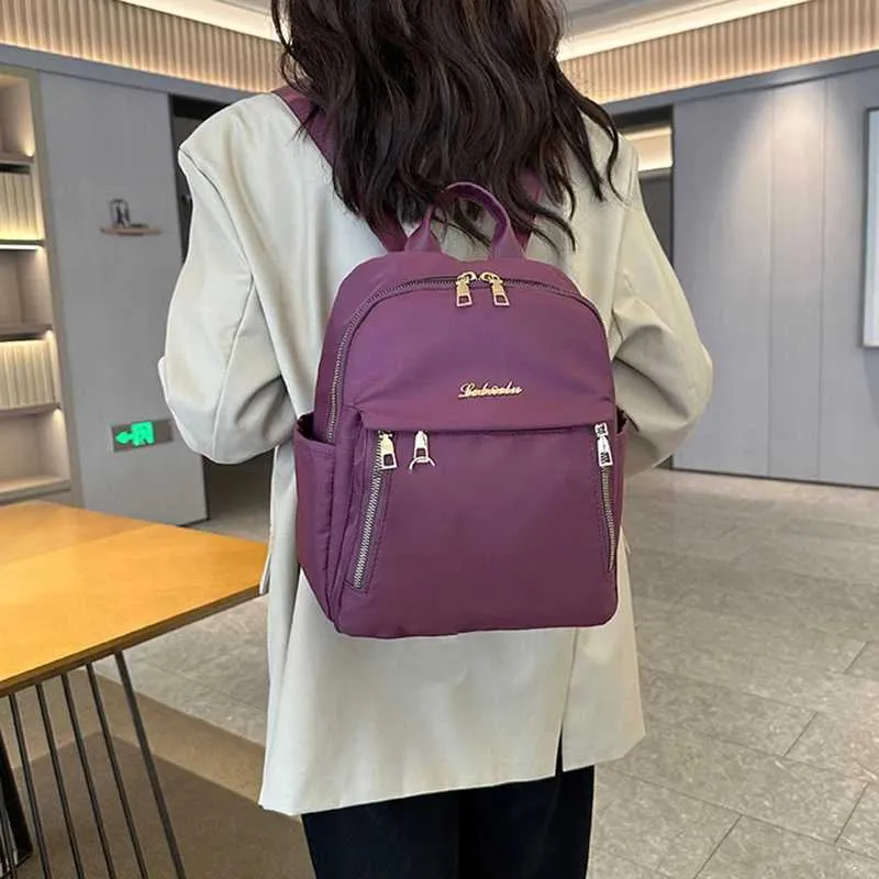 Sac à dos à la mode en nylon imperméable à haute capacité avec fermeture éclair solide 2024 hot selg Sac polyvalent pour femme Mujer Mochila_voghion.com