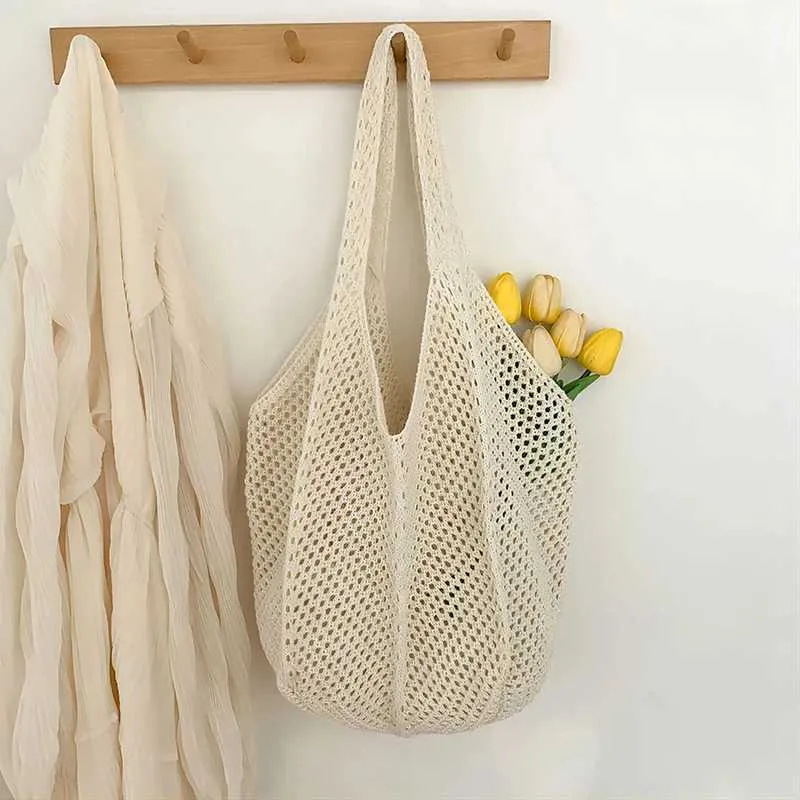 Womens crochet handbag mesh beach large capacity fashionable knitted shoulder solid color simple shopping bag Y241011_voghion.com