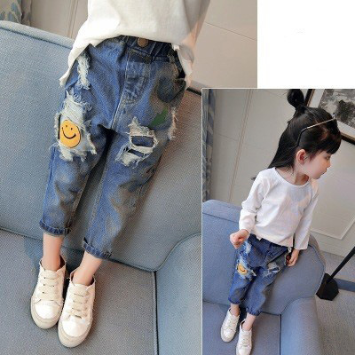 Mère et enfants printemps et automne nouveaux vêtements pour petites et moyennes filles bébé dessin animé Smiley Face étiquette déchiré jean décontracté pantalon droit_voghion.com