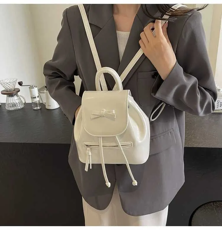 Mochila feminina sólida com aba e laços, mini bolsas de ombro, versátil, feminina, grande capacidade, bolsas de couro, casual, estudante_voghion.com