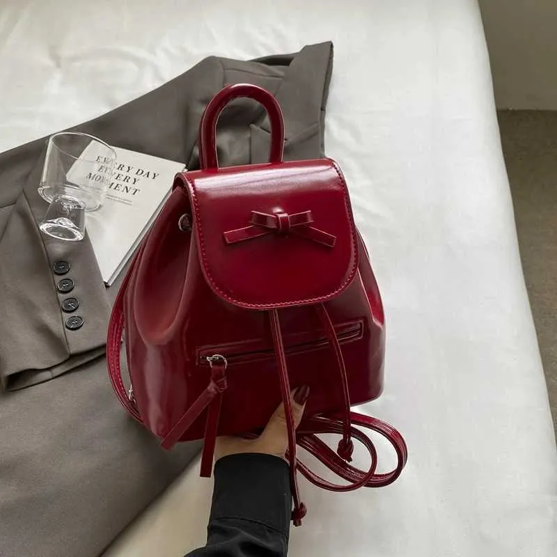 Mochila feminina sólida com aba e laços, mini bolsas de ombro, versátil, feminina, grande capacidade, bolsas de couro, casual, estudante_voghion.com