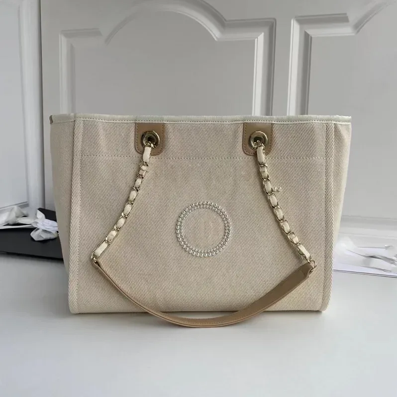 Designer-Tasche aus Segeltuch mit Perlengriff | Klassische Modehandtasche 2024_voghion.com