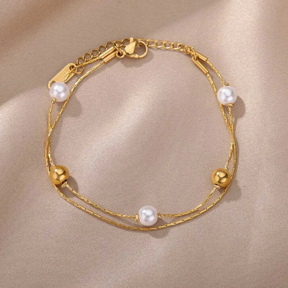 Pulsera de doble cadena con perlas en acero inoxidable dorado_voghion.com