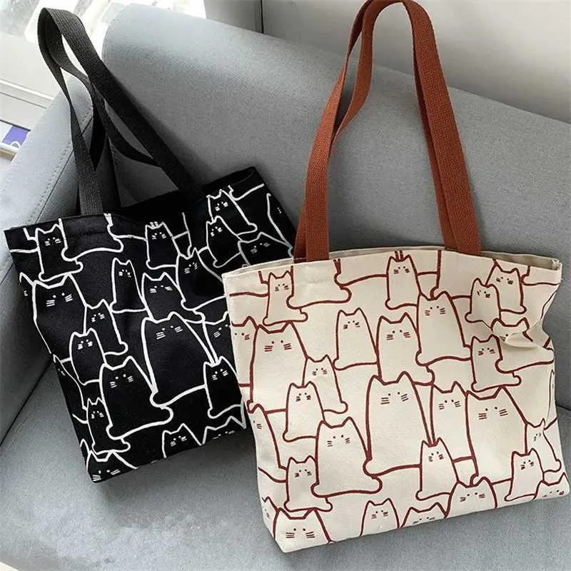 Canvas 2023 fashionable cute cat handbag messenger with zipper designer womens cartoon shoulder shopping bag Y241011_voghion.com
