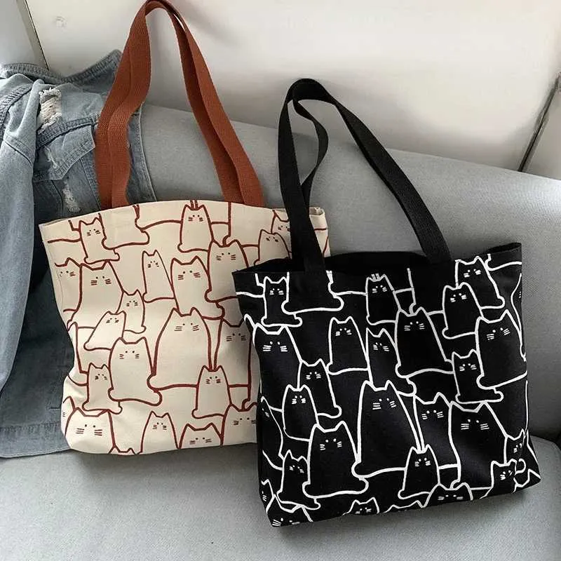 Canvas 2023 fashionable cute cat handbag messenger with zipper designer womens cartoon shoulder shopping bag Y241011_voghion.com