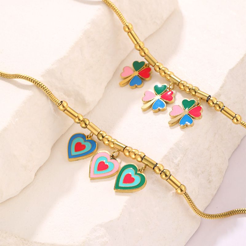 Bracciale personalizzato in acciaio inossidabile placcato oro con ciondolo a forma di quadrifoglio Dripping Love_voghion.com