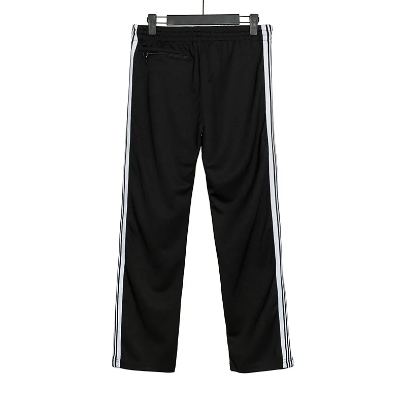 Mäns Needles-spår Fritidsbyxor Streetwear AWGE Träningsbyxor Kvinnor Herr Randig Dragkedja Byxa Butterfly Broderi Joggers Needles_voghion.com