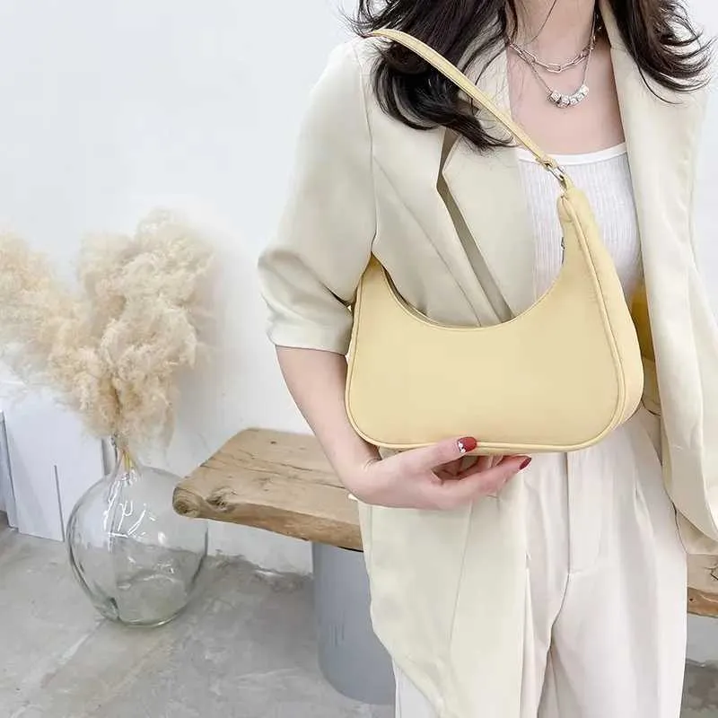 Wens Nyl Shoe 2023 Fi Solid Canvas Dumpg Unterarm Designer Tasche Cluh Geldbörse und Handtasche Y241026_voghion.com