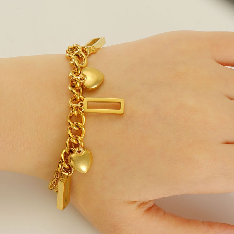 Braccialetto alla moda in acciaio inossidabile con combinazione di titanio, dorato, geometrico, design di nicchia per le donne_voghion.com