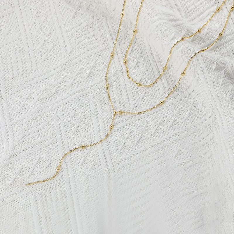 Collier empilable multicouche en forme de Y en acier inoxydable avec perles rondes et pampilles doubles_voghion.com