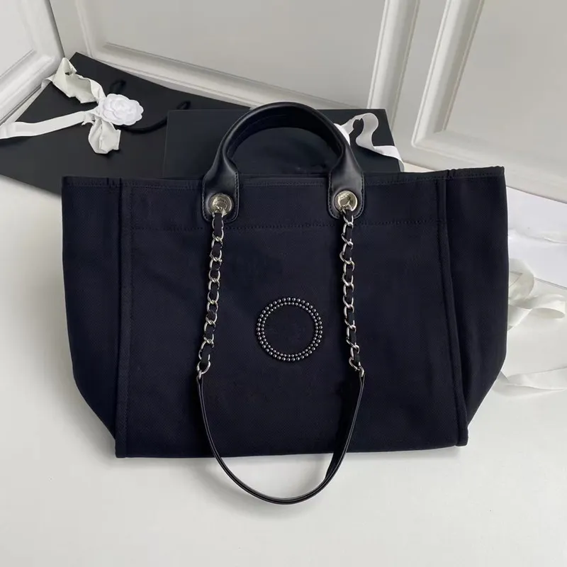 Designer-Tasche aus Segeltuch mit Perlengriff | Klassische Modehandtasche 2024_voghion.com