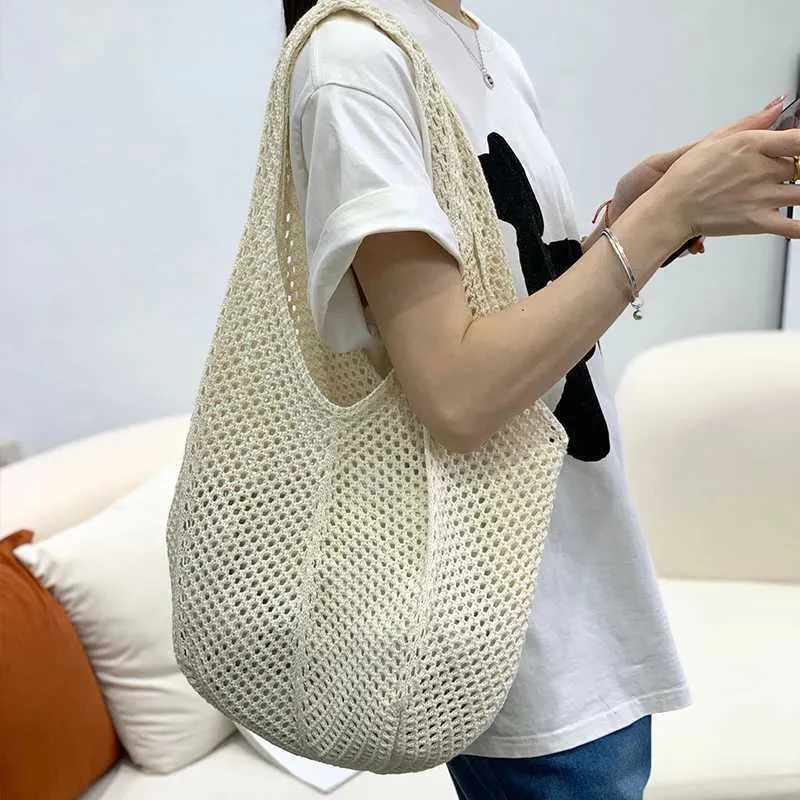Womens crochet handbag mesh beach large capacity fashionable knitted shoulder solid color simple shopping bag Y241011_voghion.com