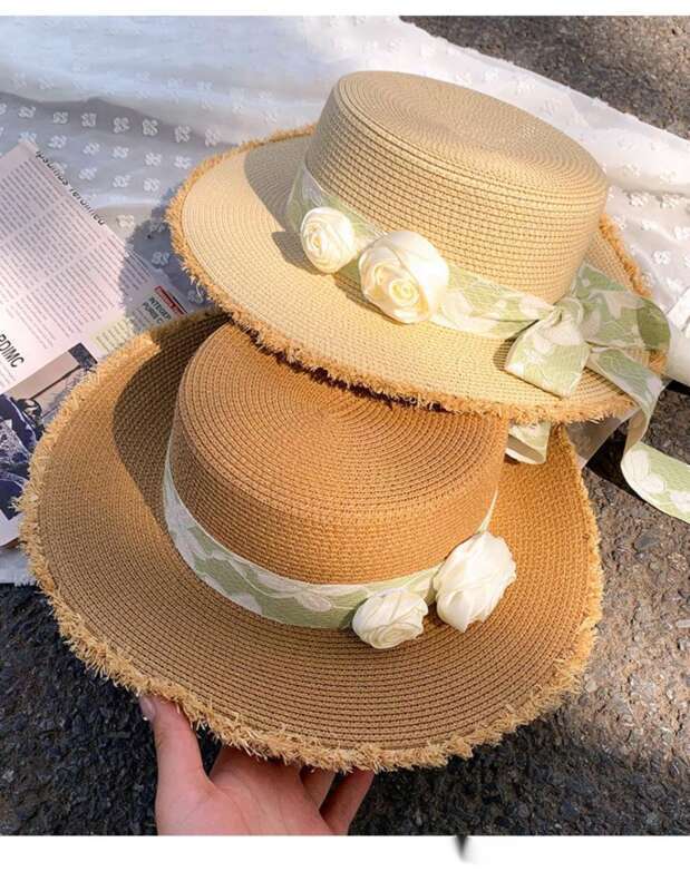 Cappello da spiaggia estivo da donna con tesa larga e fiore in paglia con fiocco e parte superiore piatta Lafite_voghion.com