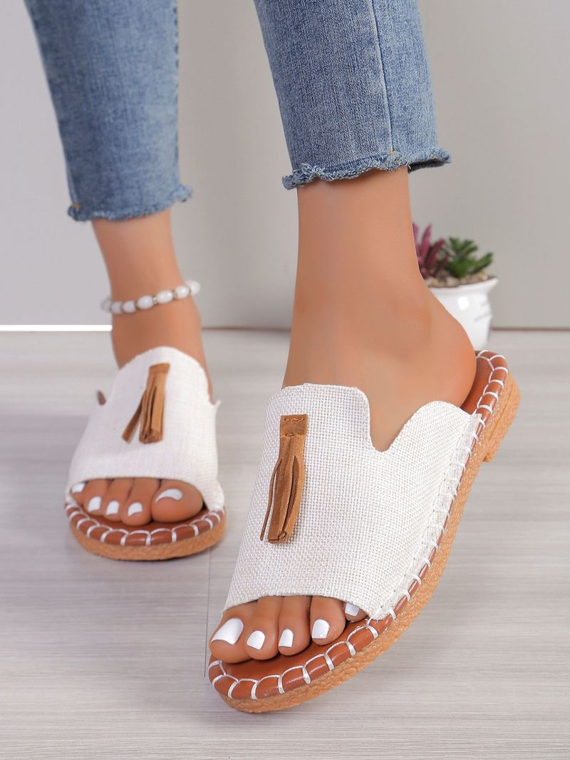 Pantofole da donna con punta aperta e nappe piatte alla moda_voghion.com