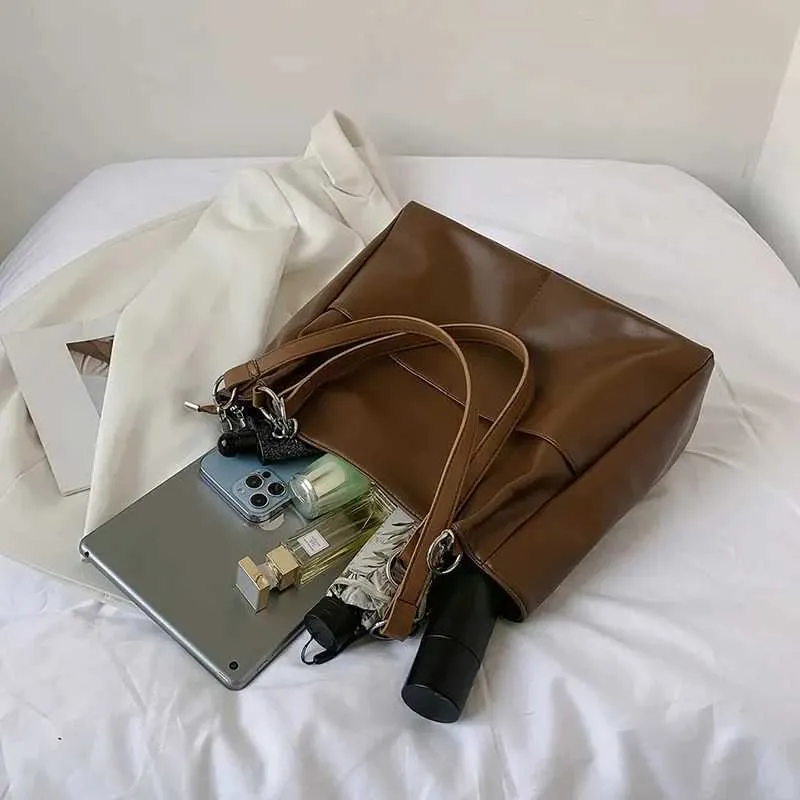 Sacs à bandoulière pour femmes Vintage Couleur unie Simple Grande capacité Grand cuir PU Les derniers sacs à main de voyage_voghion.com