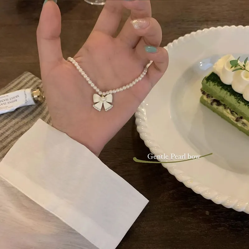 Collier avec pendentif en forme de nœud en perles de haute qualité pour femme, joli bijou, accessoire, cadeau de mariage_voghion.com