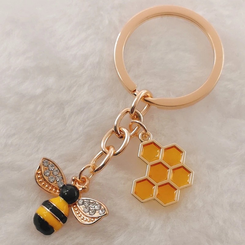 Llavero con forma de abeja y diamantes de imitación en forma de panal hexagonal para mujer_voghion.com