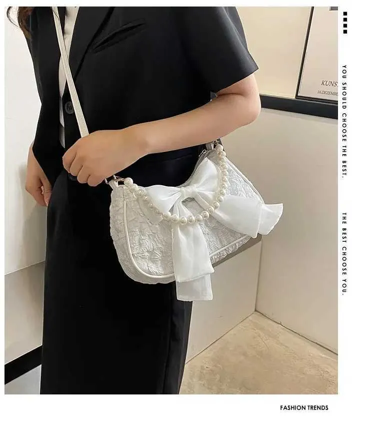 Bolsa de ombro e tiracolo feminina com pérolas e laço_voghion.com