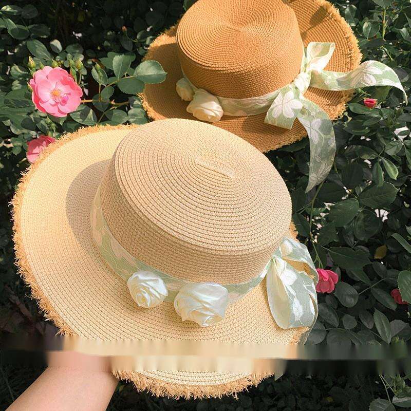 Cappello da spiaggia estivo da donna con tesa larga e fiore in paglia con fiocco e parte superiore piatta Lafite_voghion.com