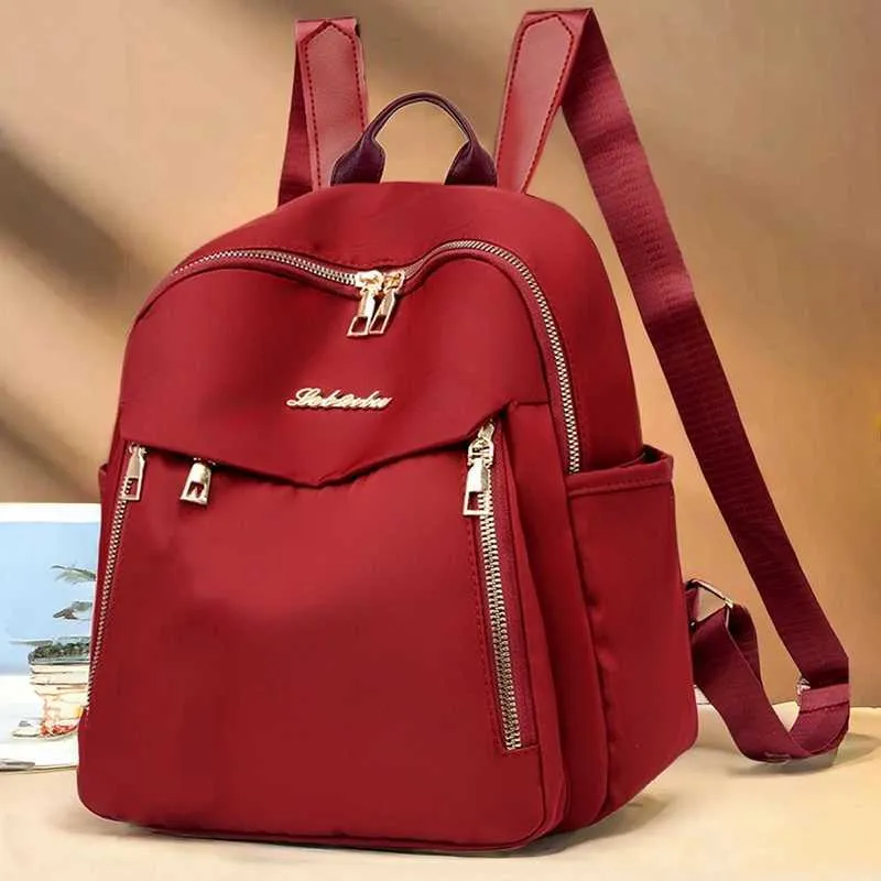 Sac à dos à la mode en nylon imperméable à haute capacité avec fermeture éclair solide 2024 hot selg Sac polyvalent pour femme Mujer Mochila_voghion.com