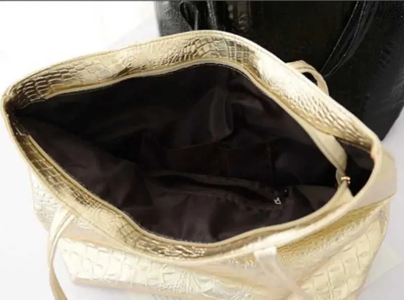 Designer schoudertas en tote bag voor dames in zwart en goud_voghion.com
