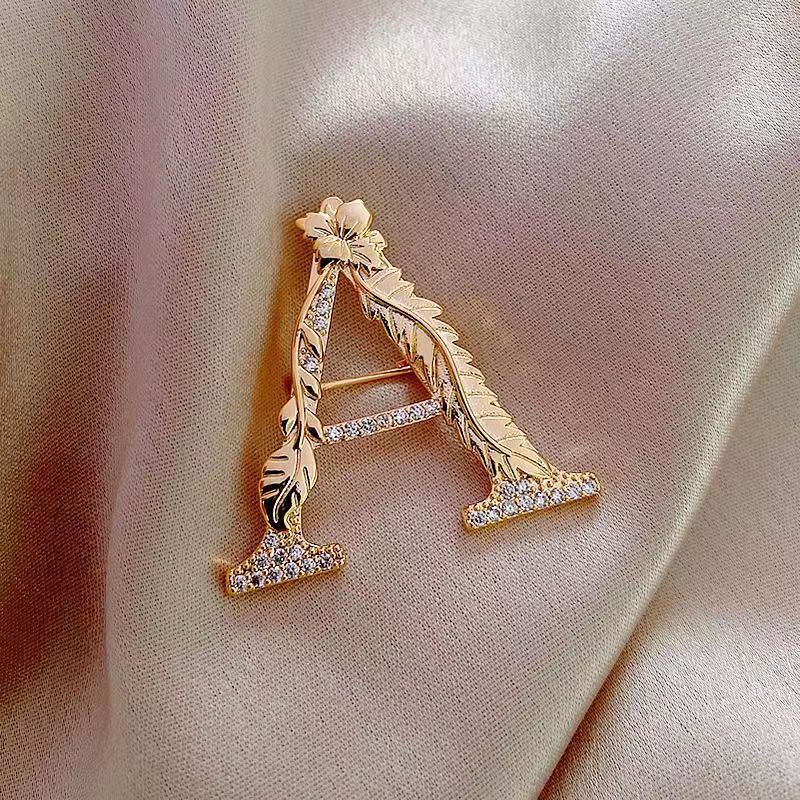 Light luxury temperament fashion A letter brooch ins design leaf flower diamond anti exposure clothing accessories pin