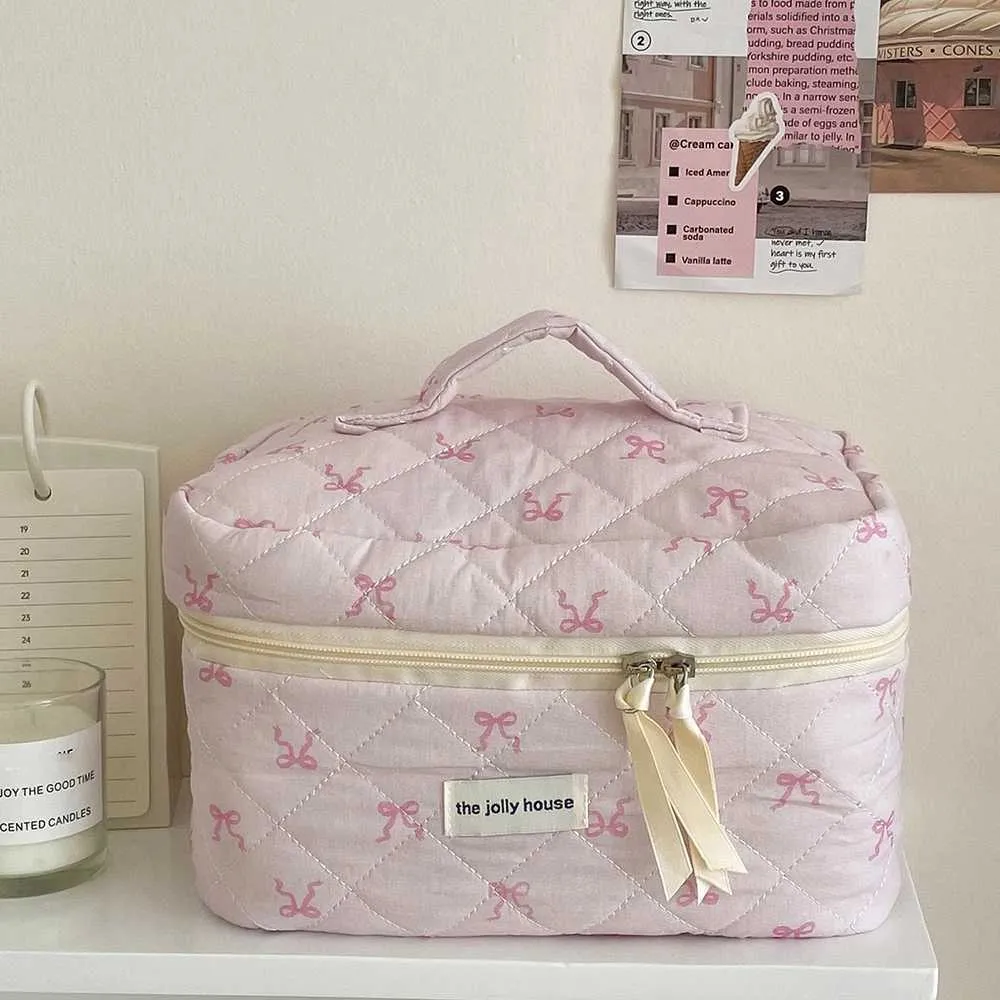 2024 Rosa Schleife Stepptasche Tragbarer Reißverschluss Make-Up Reiseveranstalter Damen Handtasche Y241023_voghion.com