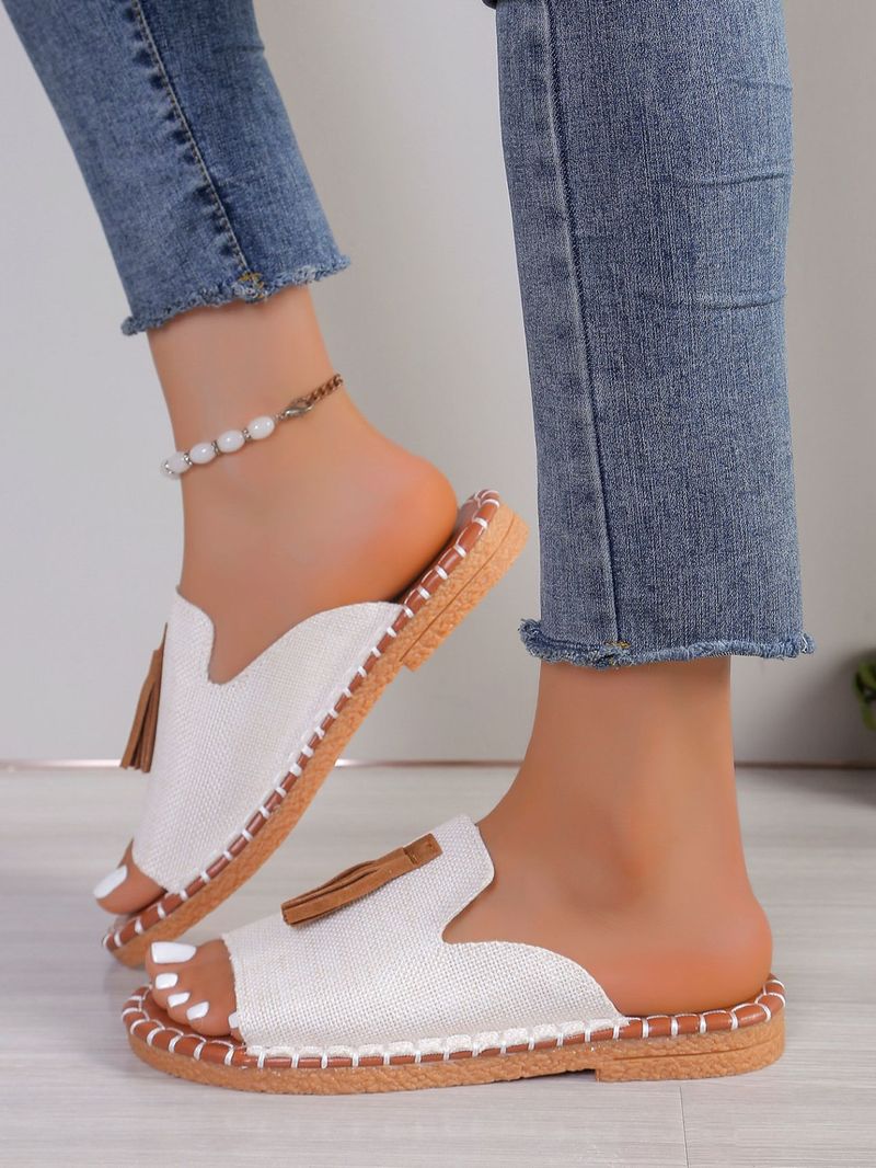 Pantofole da donna con punta aperta e nappe piatte alla moda_voghion.com