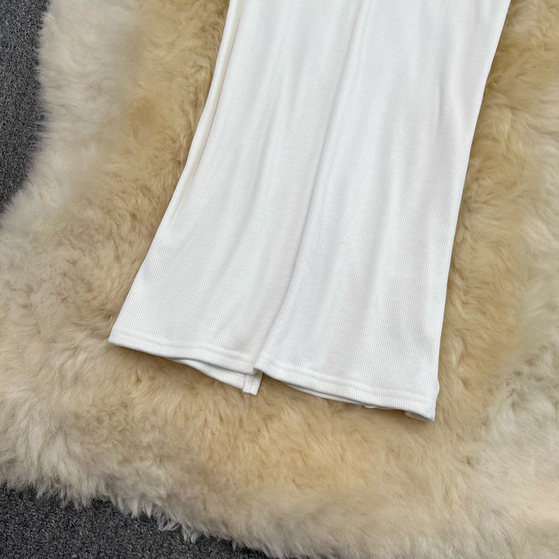 Gonna a sirena in maglia aderente con spacco sopra il ginocchio, a vita alta e lunghezza media, da donna_voghion.com