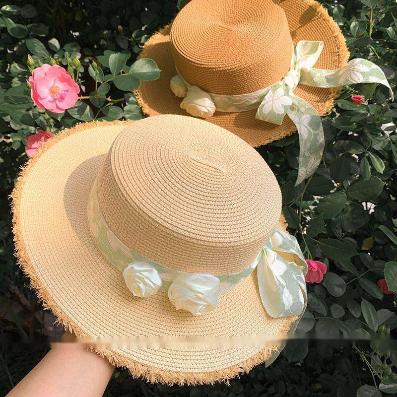 Cappello da spiaggia estivo da donna con tesa larga e fiore in paglia con fiocco e parte superiore piatta Lafite_voghion.com