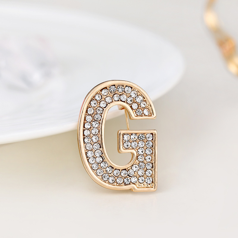 Spilla versatile con lettere inglesi in strass, stemma con fiore sul petto, luce antiscivolo, alla moda per uomo e donna_voghion.com