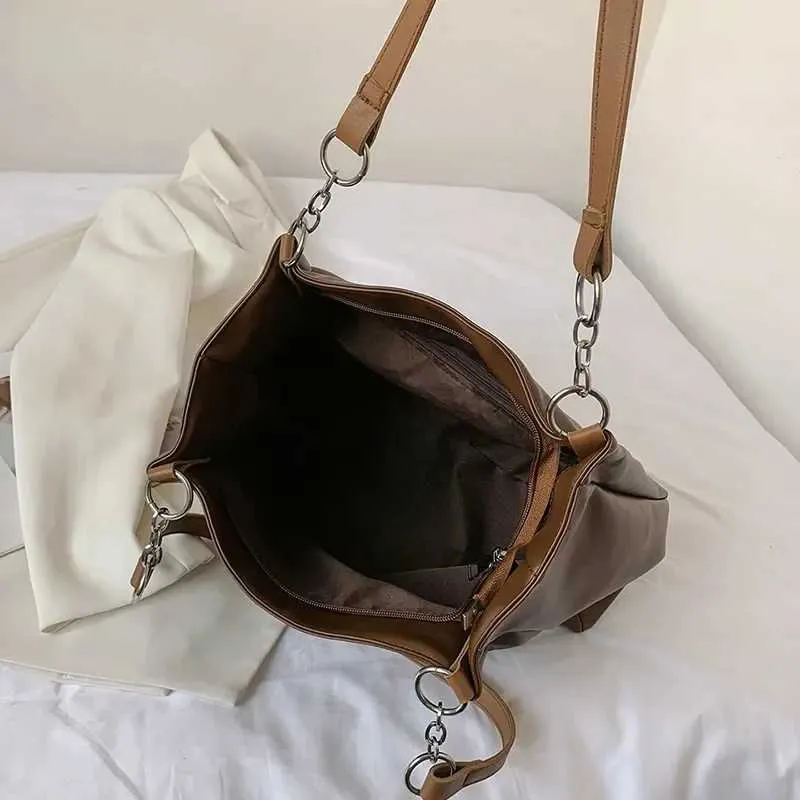 Sacs à bandoulière pour femmes Vintage Couleur unie Simple Grande capacité Grand cuir PU Les derniers sacs à main de voyage_voghion.com