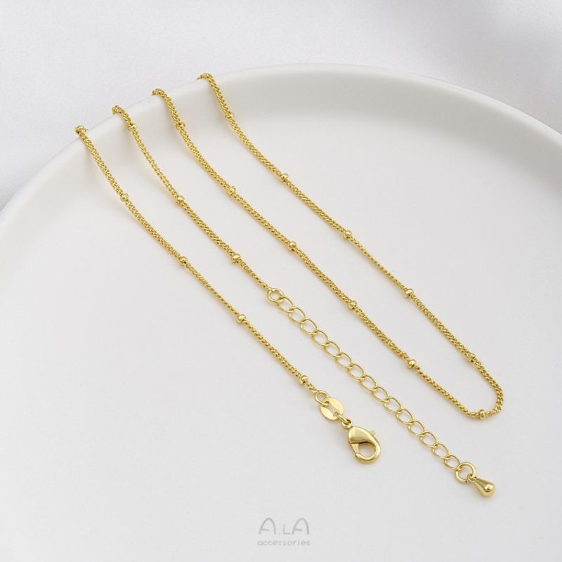 Catena di estensione a goccia d'acqua con perlina piatta O in acciaio JF14K con finitura in oro vero, colore preservato, clavicola da 45 cm_voghion.com