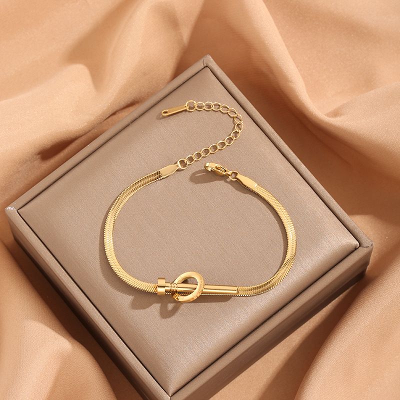 Braccialetto in acciaio al titanio e oro semplice stile Nail Light da donna_voghion.com