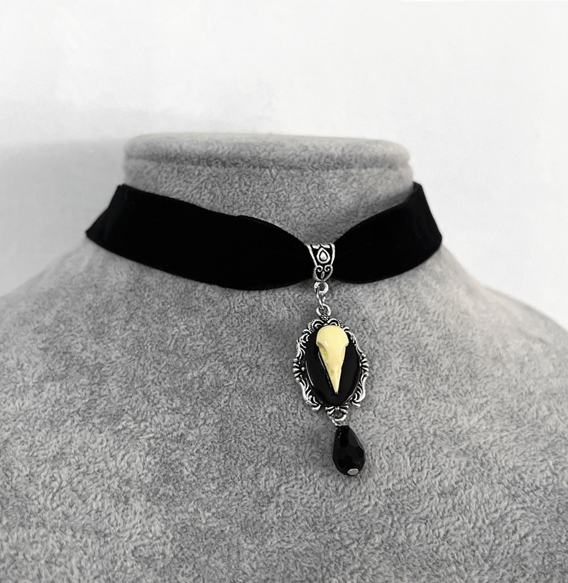 Collana unisex con orecchino a forma di teschio di uccello_voghion.com