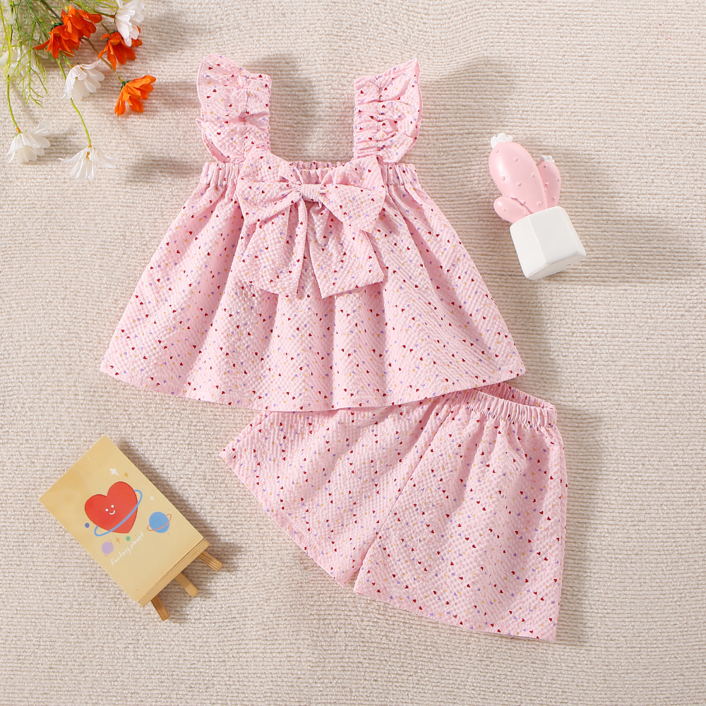 Peutermeisjes kinderkledingset van katoen, klein hartje, bedrukt, geel/roze strik, top en short_voghion.com