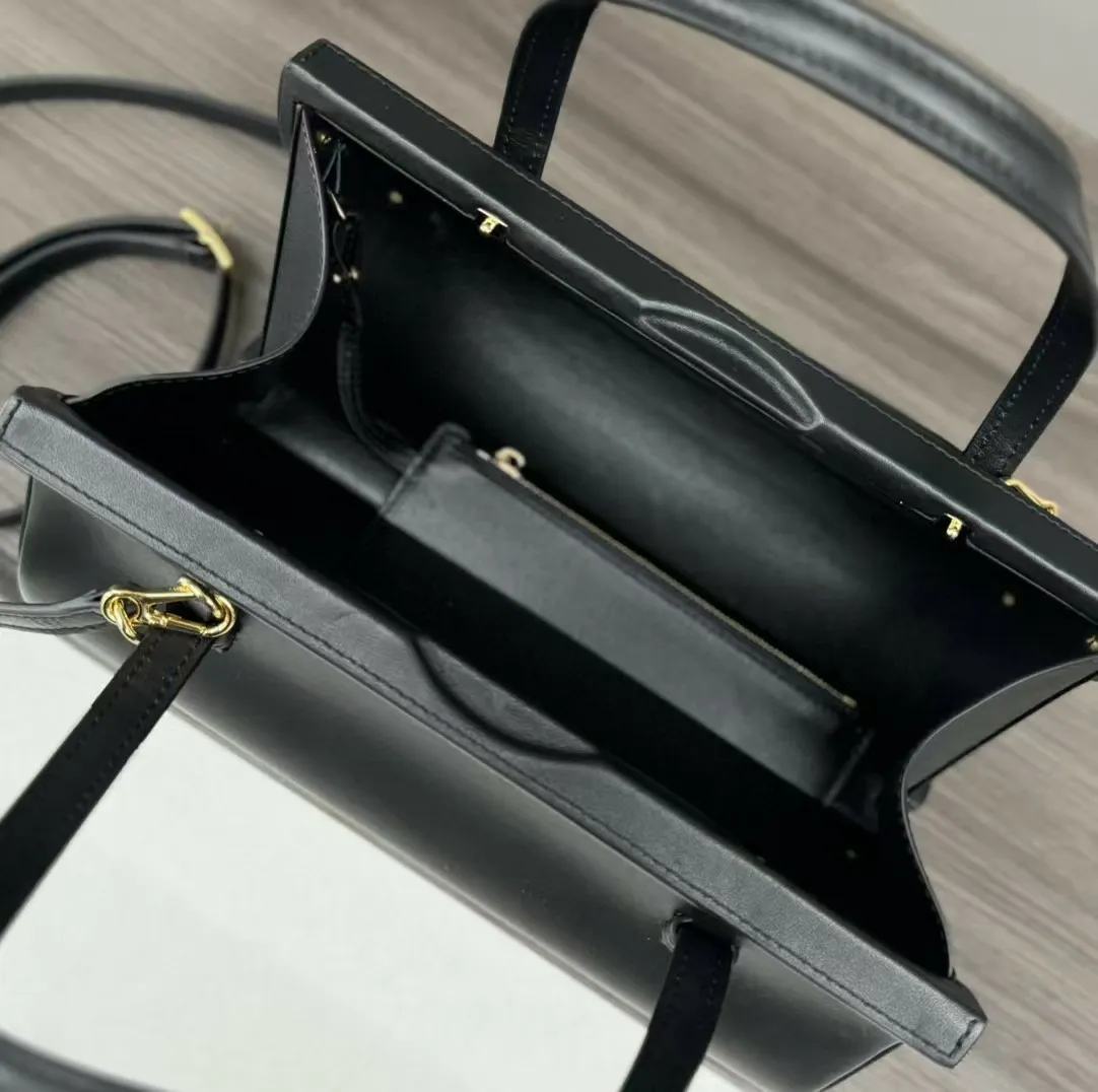 Elegante Tasche mit Henkel aus hochwertigem Leder – glattes Röhrendesign, goldfarbene Metallteile für den täglichen Gebrauch_voghion.com