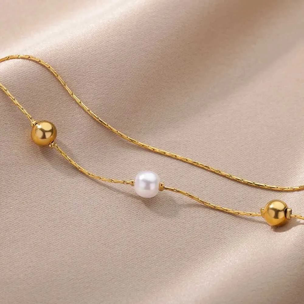 Pulsera de doble cadena con perlas en acero inoxidable dorado_voghion.com