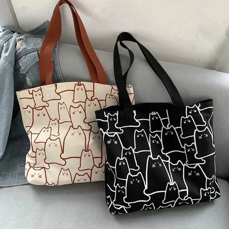 Canvas 2023 fashionable cute cat handbag messenger with zipper designer womens cartoon shoulder shopping bag Y241011_voghion.com