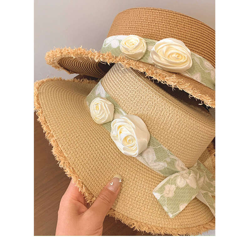 Cappello da spiaggia estivo da donna con tesa larga e fiore in paglia con fiocco e parte superiore piatta Lafite_voghion.com