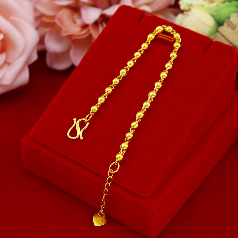 Bracciale con perline dorate da donna elegante tondo liscio_voghion.com
