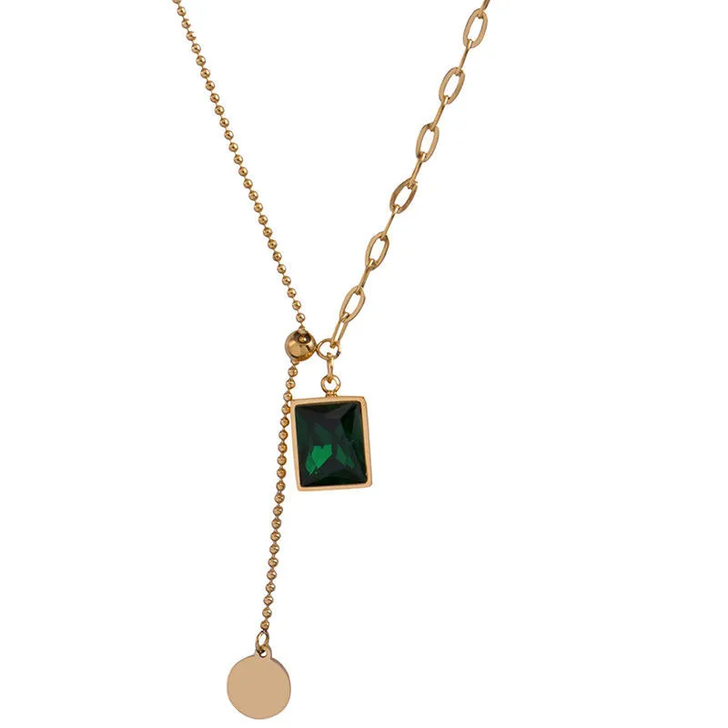 Collier pendentif zircon vert croix chaîne acier titane femme_voghion.com