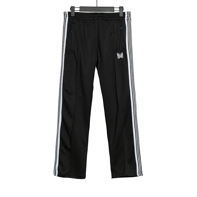 Mäns Needles-spår Fritidsbyxor Streetwear AWGE Träningsbyxor Kvinnor Herr Randig Dragkedja Byxa Butterfly Broderi Joggers Needles_voghion.com