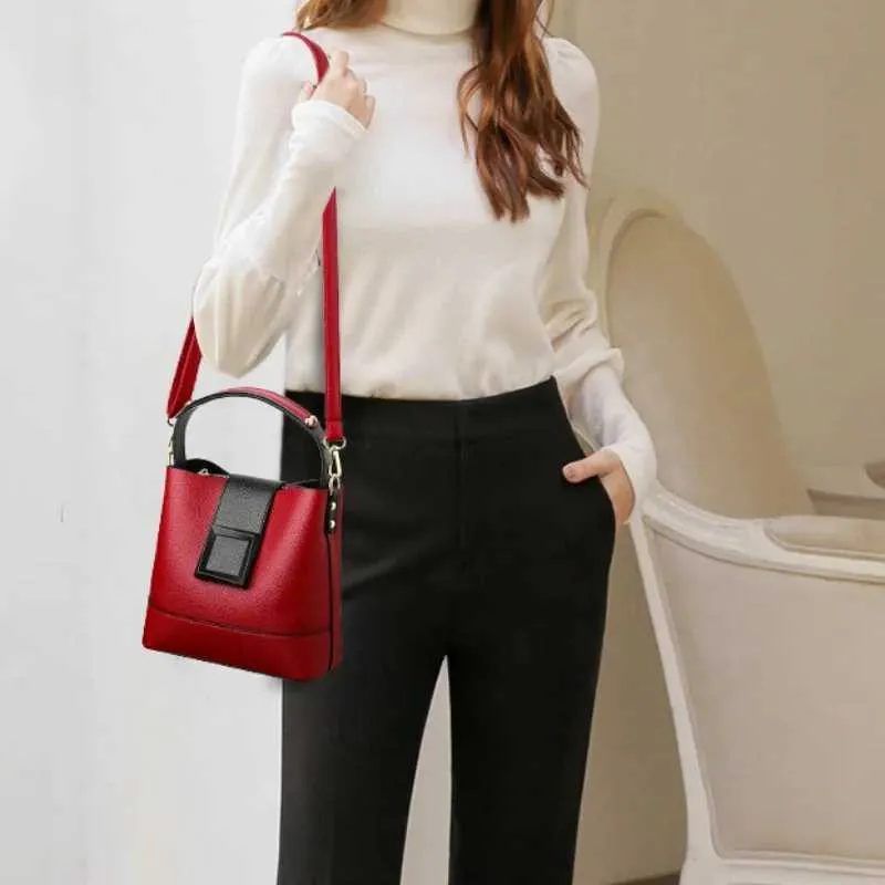 Borsa a secchiello in pelle da donna, elegante, con manico superiore, comoda tracolla, design alla moda, borsa a mano, tracolla_voghion.com