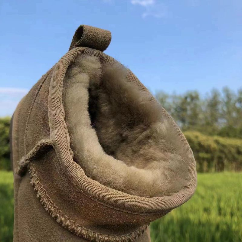 Rindslederwolle Braun Flache Absätze Lederfell Integrierte Runde Zehen Klebeschuhe Niedrig Geschnittene Mini-Schneestiefel_voghion.com