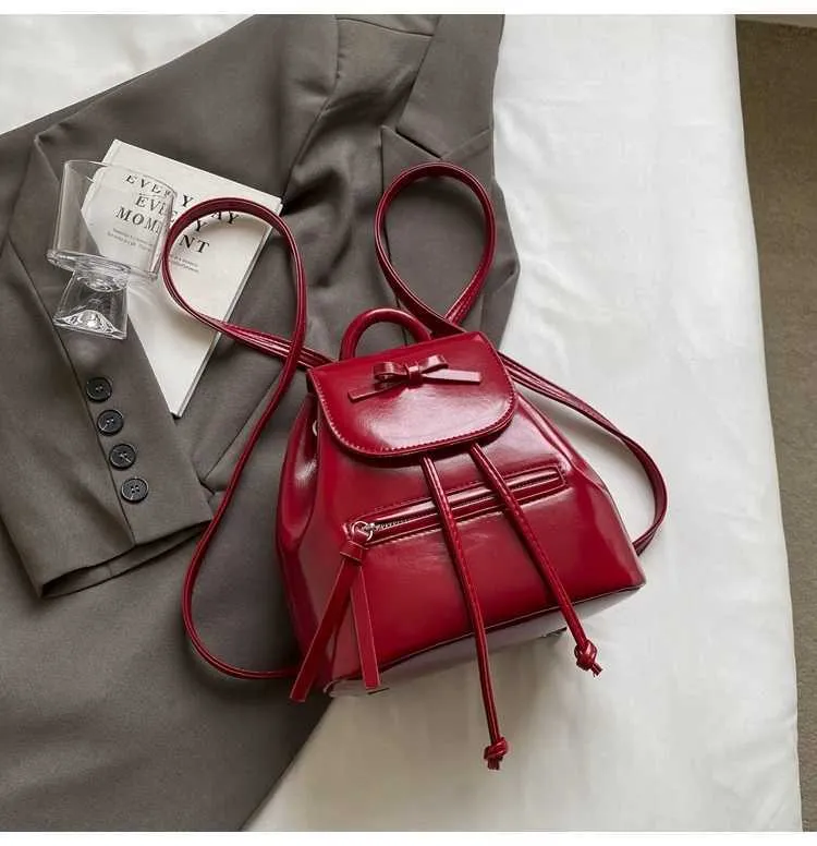 Mochila feminina sólida com aba e laços, mini bolsas de ombro, versátil, feminina, grande capacidade, bolsas de couro, casual, estudante_voghion.com