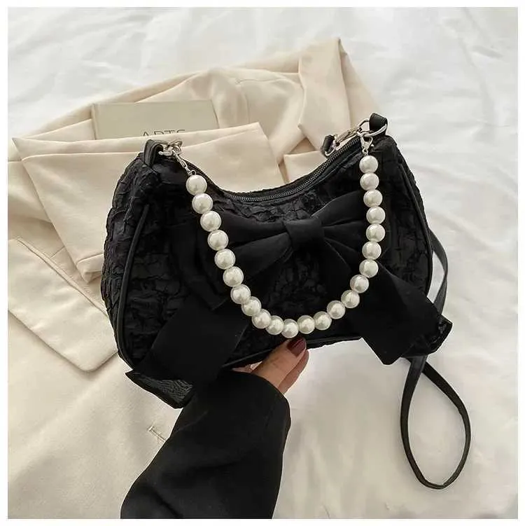Bolsa de ombro e tiracolo feminina com pérolas e laço_voghion.com